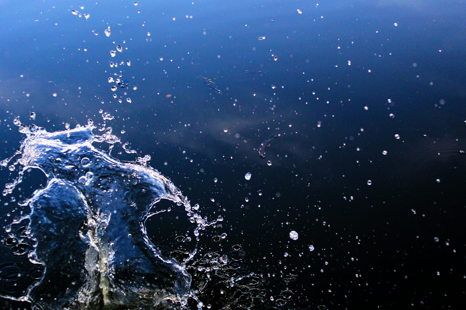 Captivating image of a water splash against a dark backdrop, showcasing dynamic motion and texture.